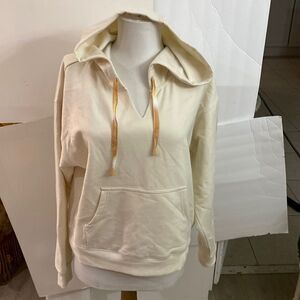 Cream colored hooded tie gold heart on sleeve super soft pocket from brand new